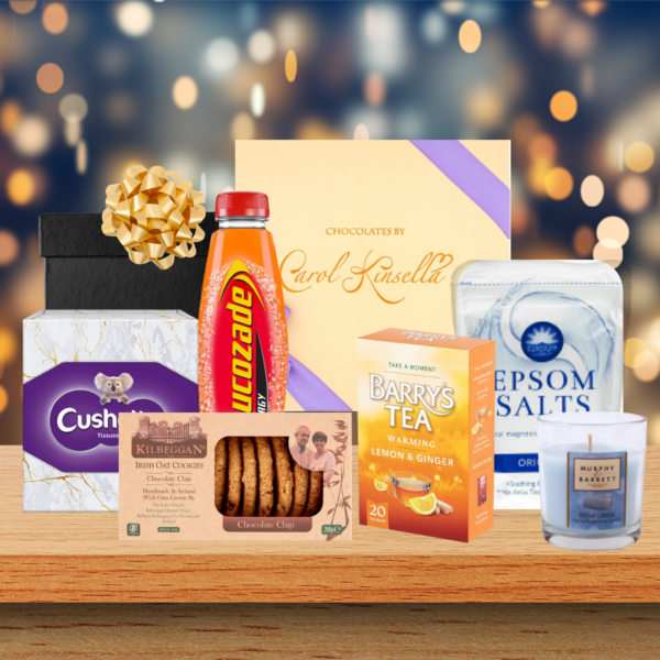 Get well soon hamper gift with lucozade, tissues, ginger tea, cookies, chocolates, epsom salts and a candle