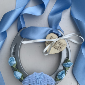 Baby Boy Good Luck Horse Shoe with blue ribbon and blue decorations