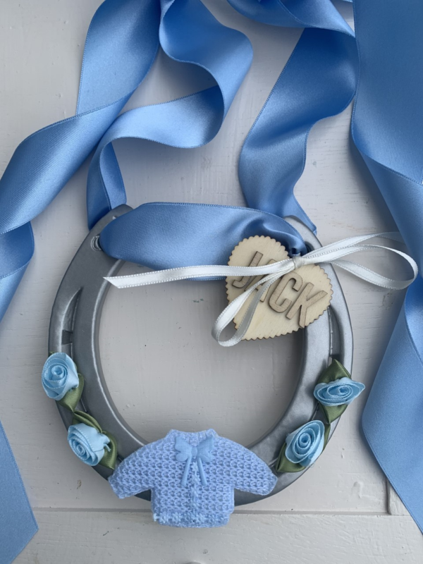 Baby Boy Good Luck Horse Shoe with blue ribbon and blue decorations